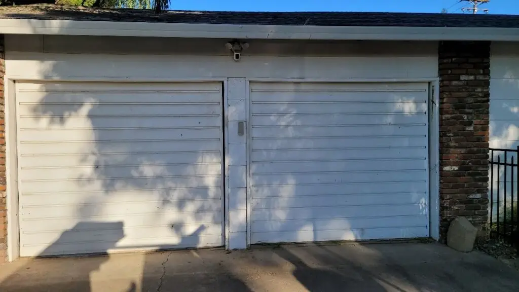 Thorpe+before2 - Mr Goldie Garage Door Mr. Goldie Garage Door - Mr. Goldie Garage Doors technician performing Yuba City garage repair on a residential property track system.