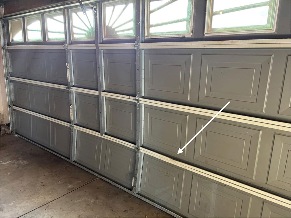 Damaged Garage Door Panel in Marysville